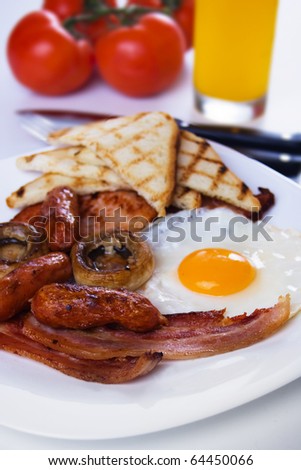 Traditional rich and healthy english breakfast food on white plate