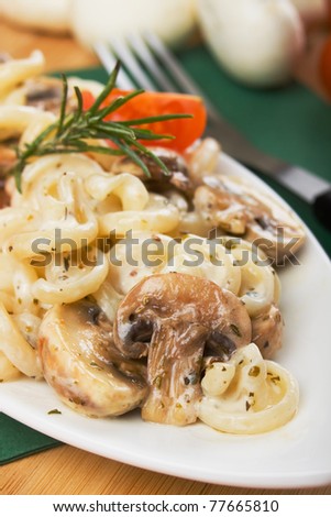 Delicious italian funghetti pasta and champignon mushrooms in white sauce