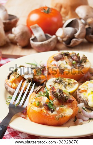 Stuffed tomato with mushrooms, cheese and herbs