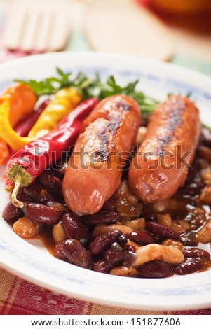 Grilled sausage with spicy chili beans and hot pepper