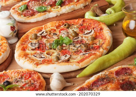 Italian funghi pizza with hot peppers, classic recipe with mushrooms, cheese and tomato