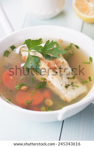 Seafood soup with cod fish steak and vegetables
