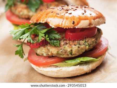Vegan burger with tomato and lettuce, healthy vegetarian version of classic american fast food