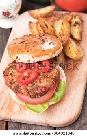 Vegan burger with tomato and lettuce, healthy vegetarian version of classic american fast food