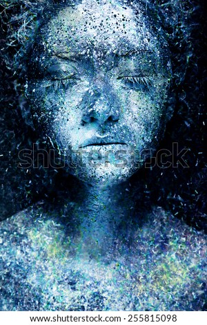 Frozen beautiful woman. Fantasy snow make up and body art. On dark background.