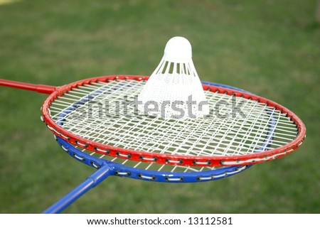 Badminton rackets with shuttlecock waits the playing time.