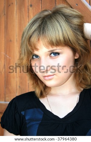 Pretty blonde girl looking at camera.