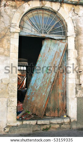 Old broken door in Limassol,Cyprus,vertical picture.