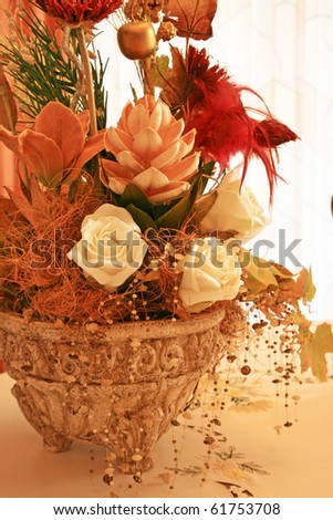 Dry and art plants and flowers in vase, vertical picture.