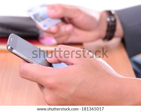 Business man holding credit card and press key for shopping online / buy / e-commerce