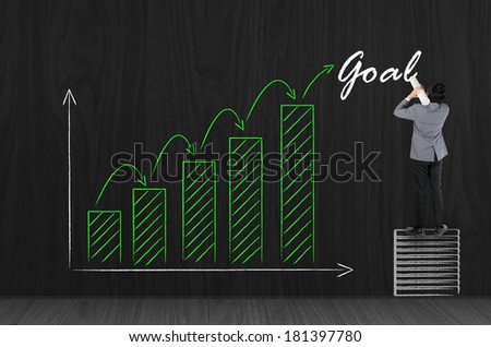 Business man drawing business growing green graph for success