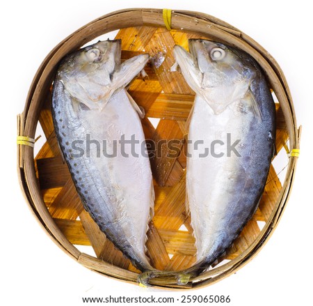 Short-bodied mackerel on bamboo dish isolated on white background