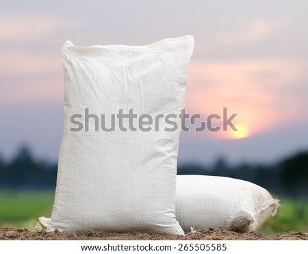 Agriculture, Fertilizer bag over sunrise background