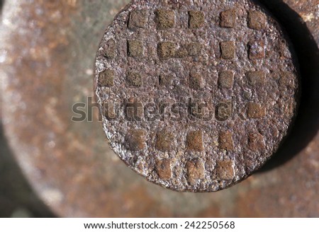Close up photo of a rusty nail head