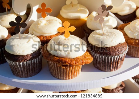 Wedding cupcakes of chocolate, vanilla, and carrotcake at a wedding reception.