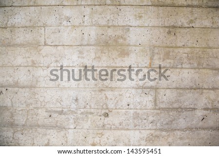 A cement wall is photographed with a wide angle lens to create this background texture image of the concrete.