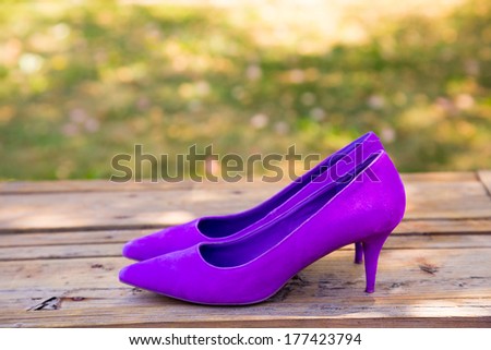 Bridal shoes for the wedding in purple before the bride has put them on her feet on the wedding day.