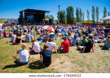 QUINCY, WA - JULY 27, 2006: Crowd of people sitting on the grass watching a performance at Creation NW, a 4 day Christian concert festival at the Gorge Ampitheater in Washington.