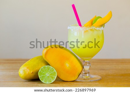 Traditional mango margarita with lime at a Mexican restaurant bar.
