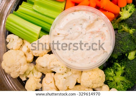 Vegetables and ranch dip for an appetizer at a wedding.