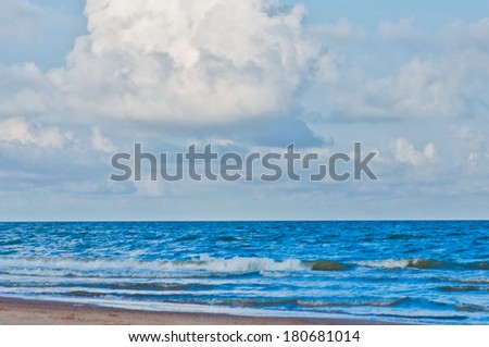 Clean sand beach and blue sky and sea.