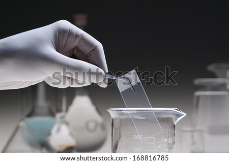 laboratory with hand - dark background
