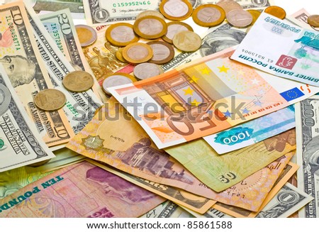 A collection of various money to background. Isolated on white.