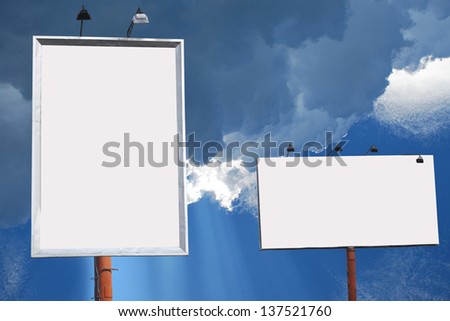 two blank boards lined with blue sky background