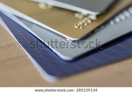 Cloesup view of credit cards in blue, silver, gold and platinum black