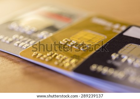 Cloesup view of credit cards in silver, gold and platinum black