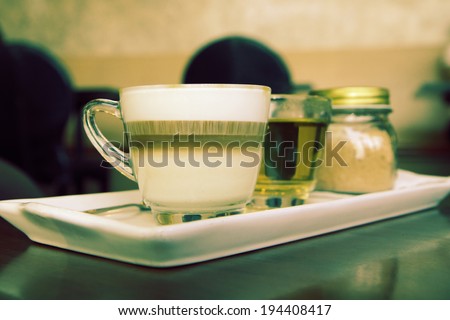 a photo of coffee set with tea and brown sugar,served on table,vintage retro style