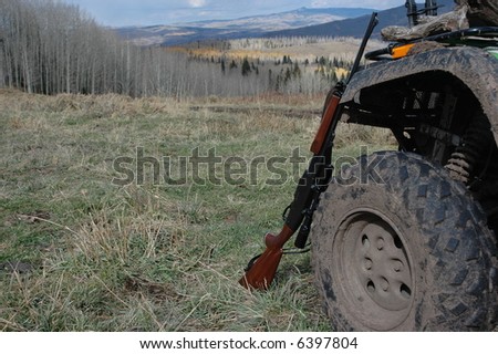 Hunting Rifle 30-06 with Four Wheeler Tire in Mountains