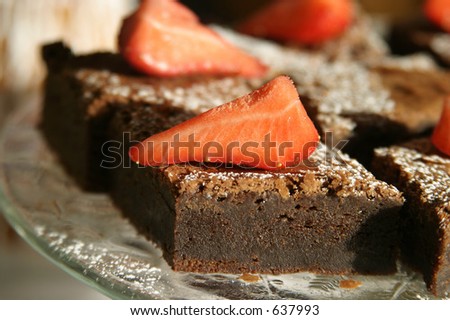 Brownie desert with strawberries on top