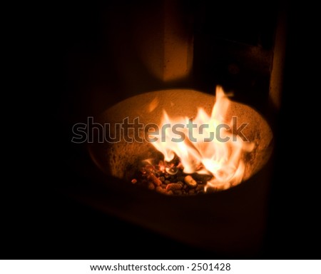 A fire place fueled by burning pellets