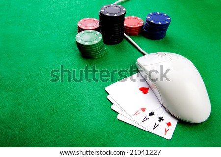 Online gaming and gambling concept, green felt, a mouse and cards