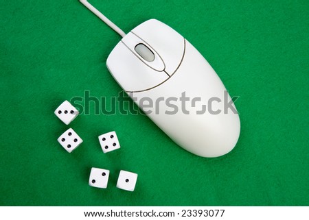 Dice and a computer mouse on a green background. - Online Gaming concept