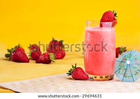 A fresh summer strawberry drink isolated on yellow