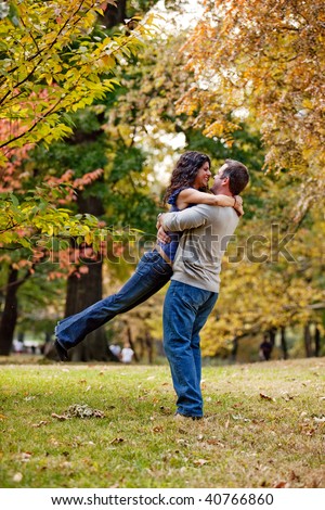 A Man And Woman Hugging In A Park Stock Photo 40766860 : Shutterstock