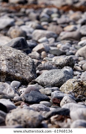 A coastal rock background with round water washed rocks
