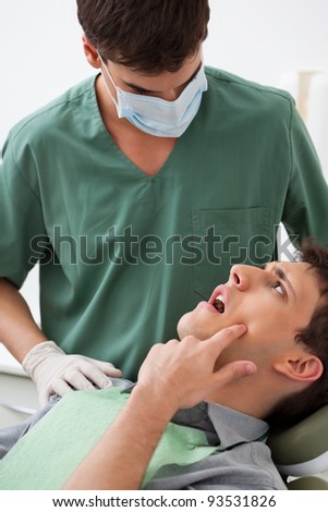 Patient showing tooth problem to the dentist