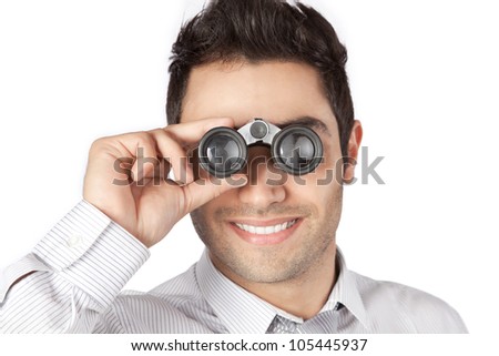 Happy young businessman looking through binocular isolated on white background.