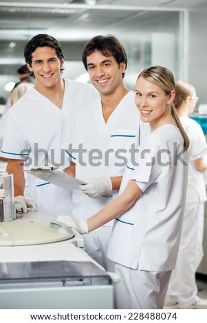 Portrait of happy technicians in laboratory