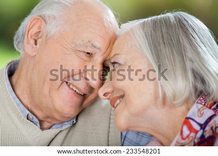 Happy senior couple looking at each other at nursing home