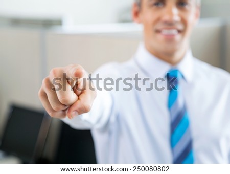 Cropped image of manager pointing at you in call center