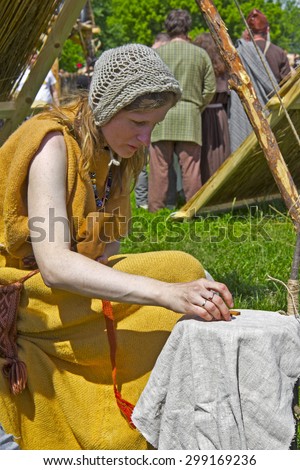 JUNE 6, 2015,  MOSCOW, RUSSIA -  Festival of the historic reconstruction Times and Ages in the park Kolomenskoye. Scandinavian fortune-teller wich uses a Runes