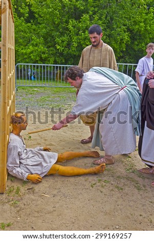 JUNE 6, 2015,  MOSCOW, RUSSIA -  Festival of the historic reconstruction Times and Ages in the park Kolomenskoye. Scene with the slave-trader and slave