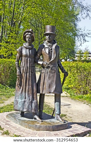 MAY 9, 2014, DMITROV, MOSCOW AREA, RUSSIA - Sculpture of a noble couple at Kropotkin street.  Kropotkin street is the walking area in central part of the historic town.