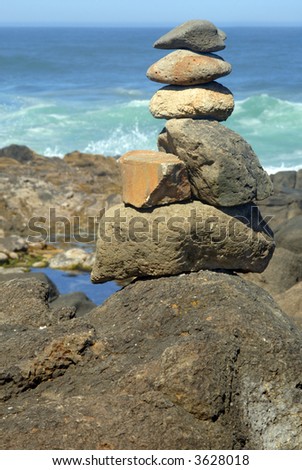 Balanced rock stack near the Pacific Ocean.
