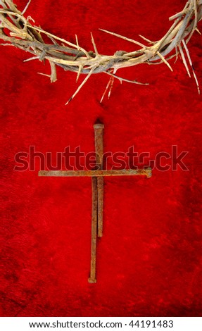 Nail spike cross with a crown of thorns.