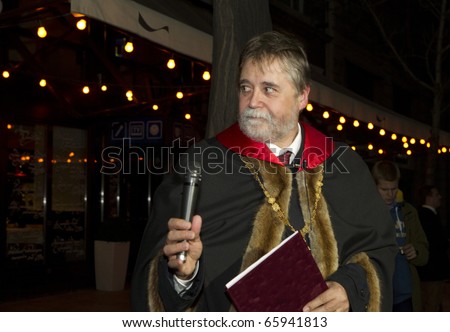 BUDAPEST, HUNGARY - NOVEMBER 12: Mr. Mezey, rector of the ELTE on the  torch-light procession, organized for the 375 anniversary of foundation of university on November 12, 2010 in Budapest, Hungary.